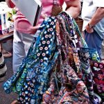 A woman with a bunch of multicolored bags