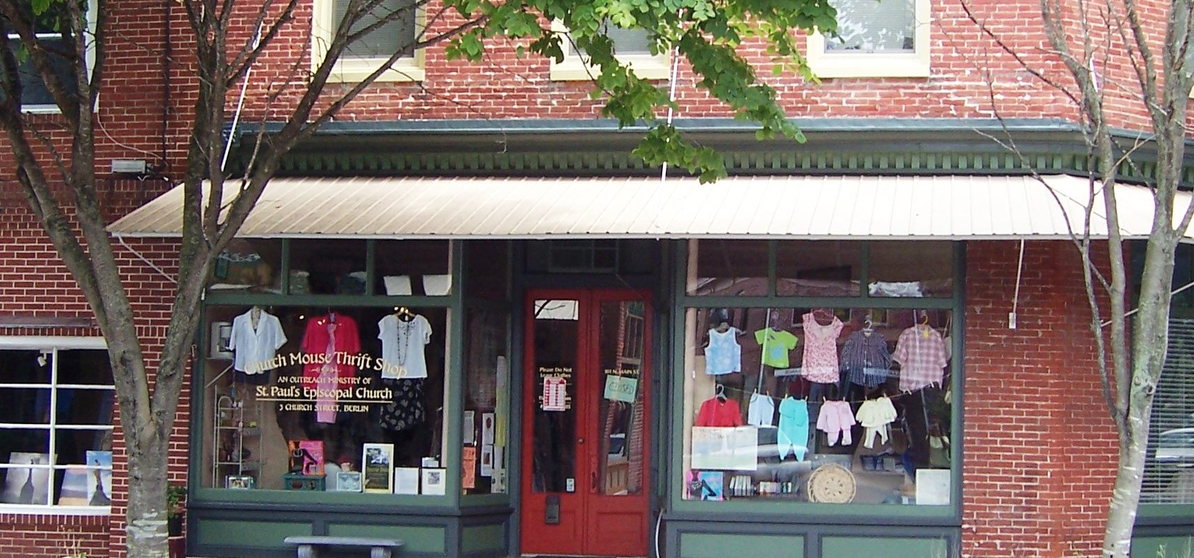 a red brick building with a store front