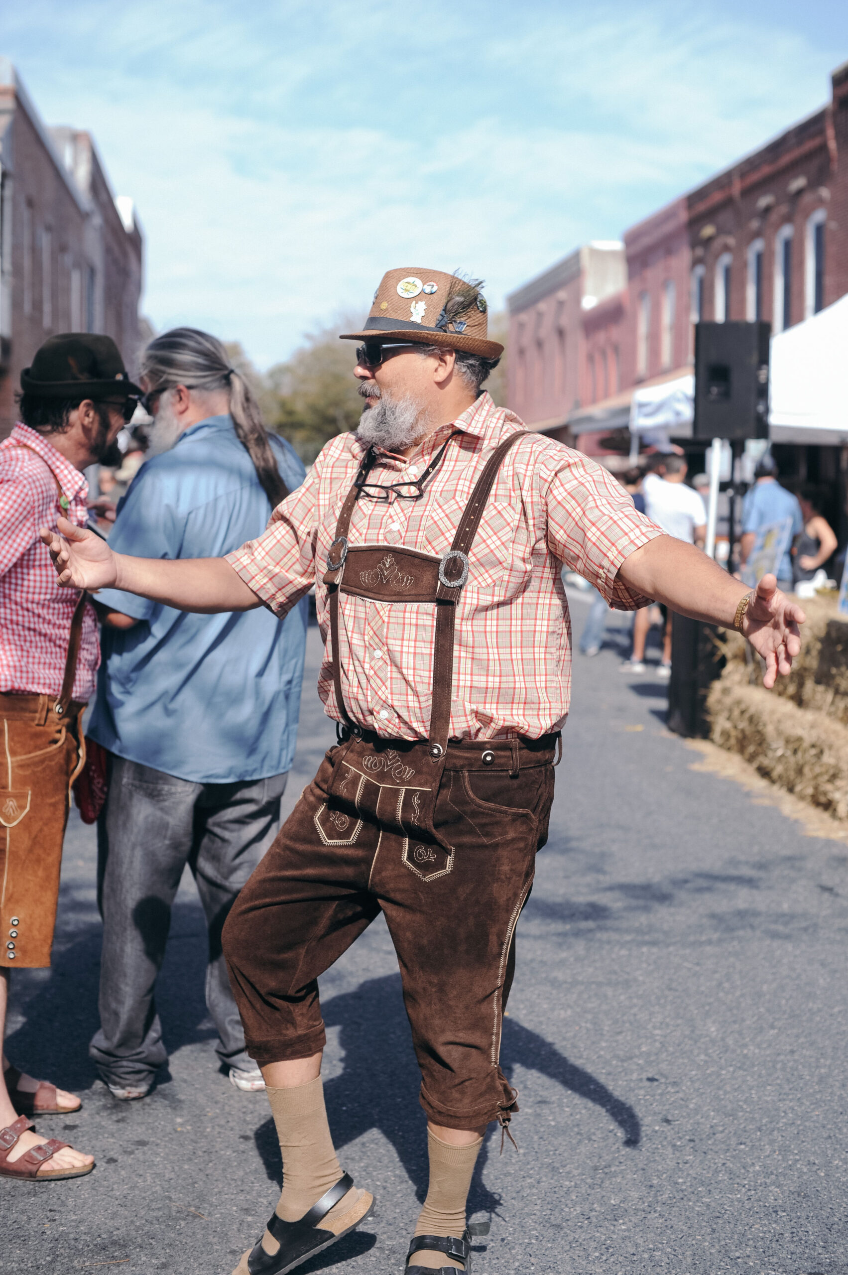a man in a costume is dancing on the street