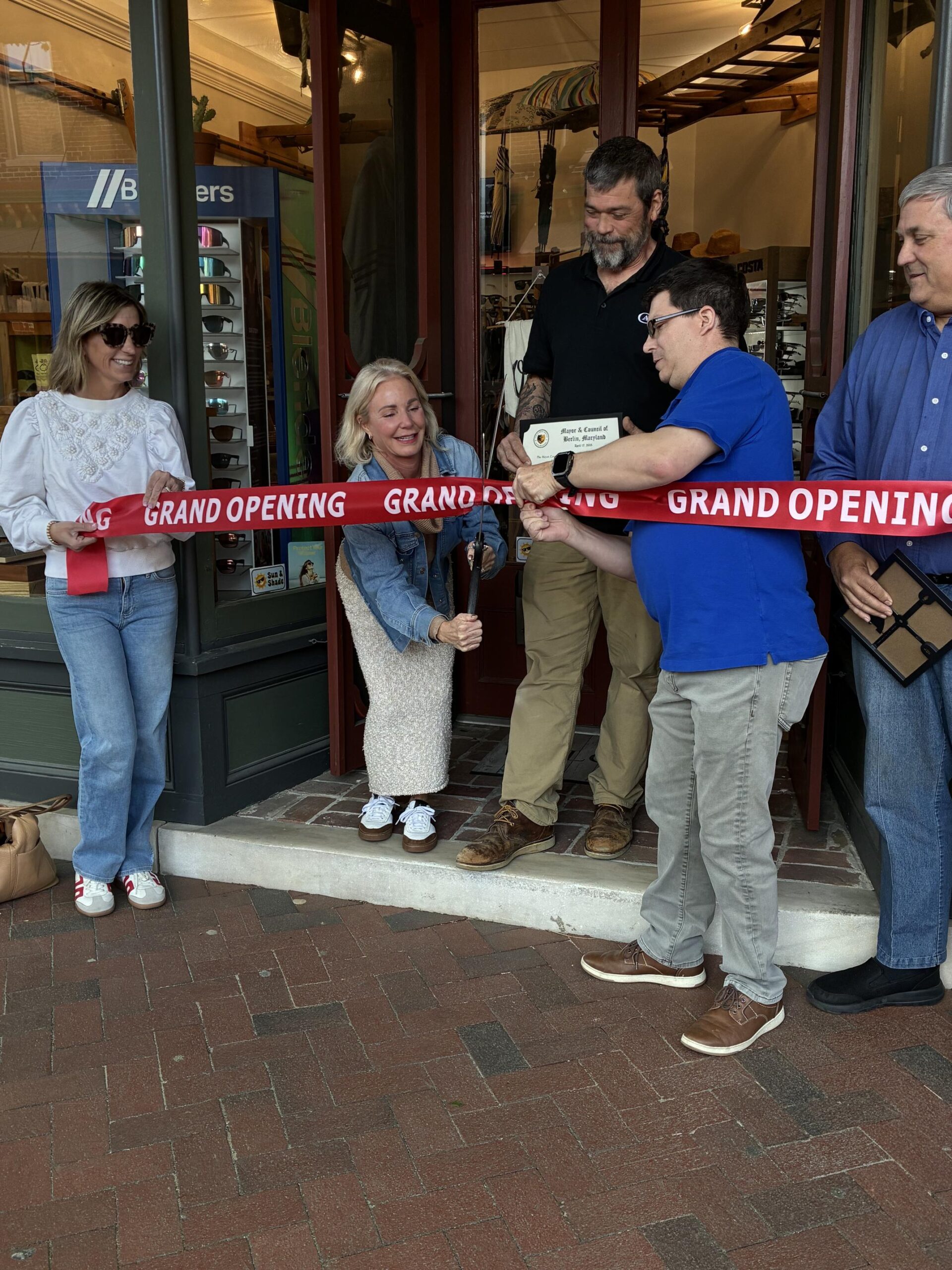 a group of people standing in front of a store